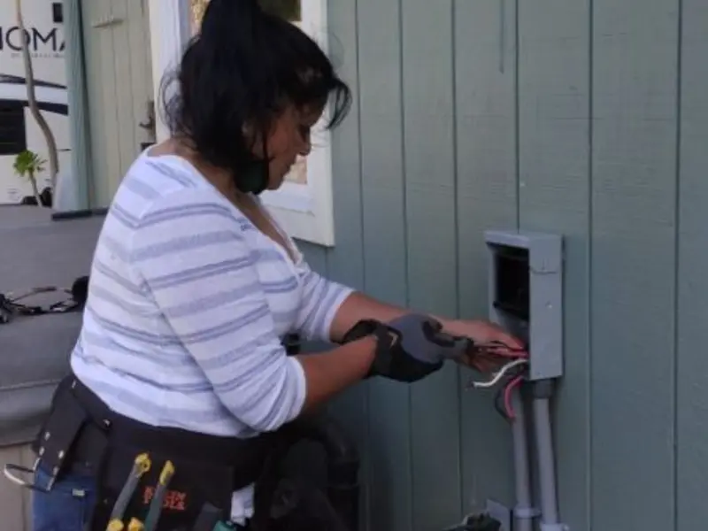 Licensed electrician wiring an exterior subpanel in Elverta